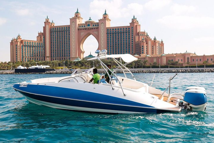 Experience the stunning sights of Dubai Marina from the comfort of a private speed boat featuring iconic landmarks like the Atlantis and Burj Al Arab perfect for memorable moments.